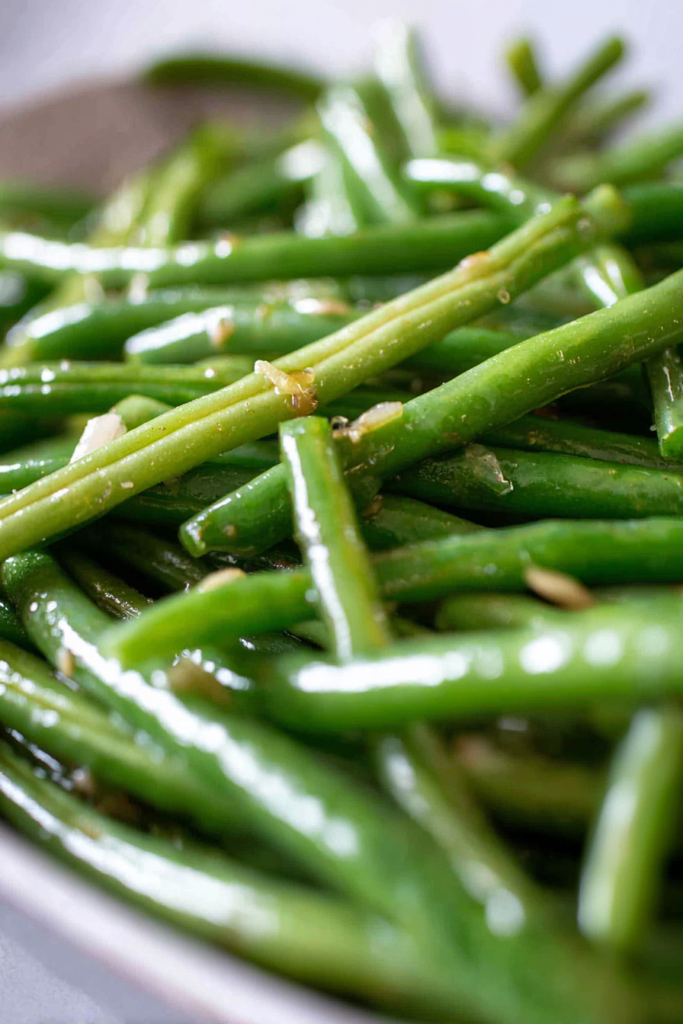 Tender green beans sautéed with garlic and sprinkled with coarse salt.