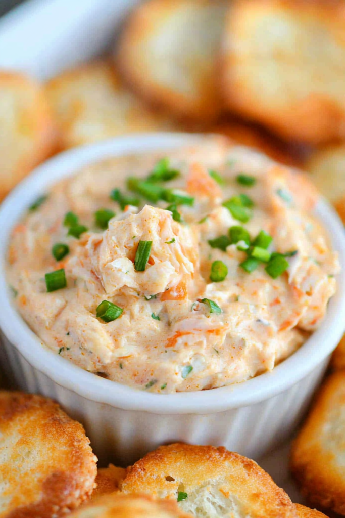 Hot and creamy appetizer dip filled with crab and spices, ready for serving.