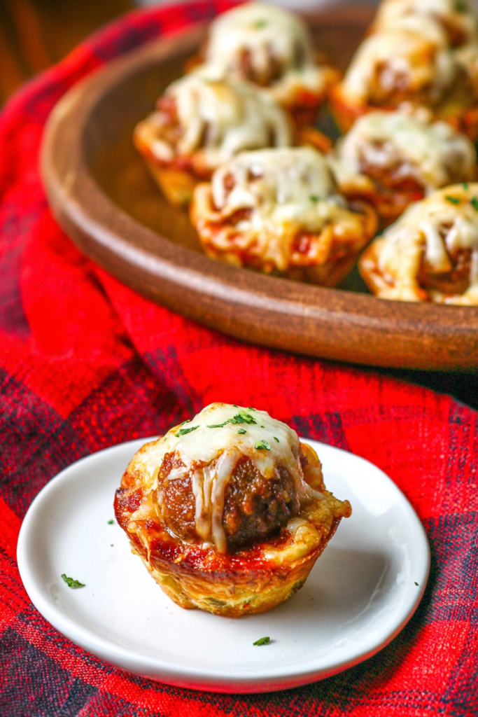 Warm, rustic cupcakes with gooey mozzarella and fresh herb garnish