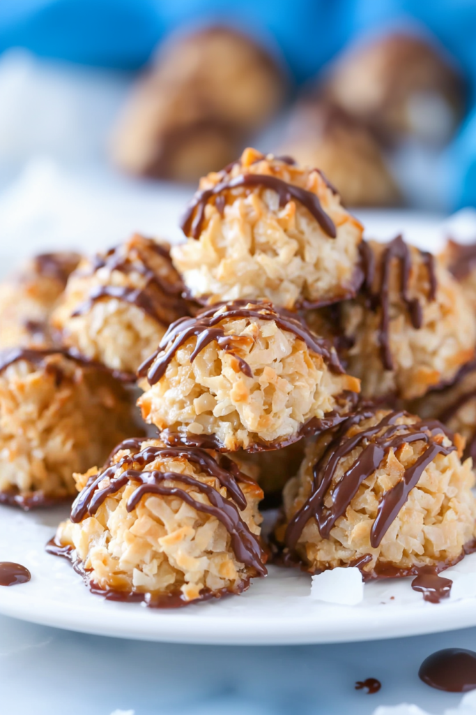 Homemade coconut macaroons with caramel and chocolate topping, ready to serve.