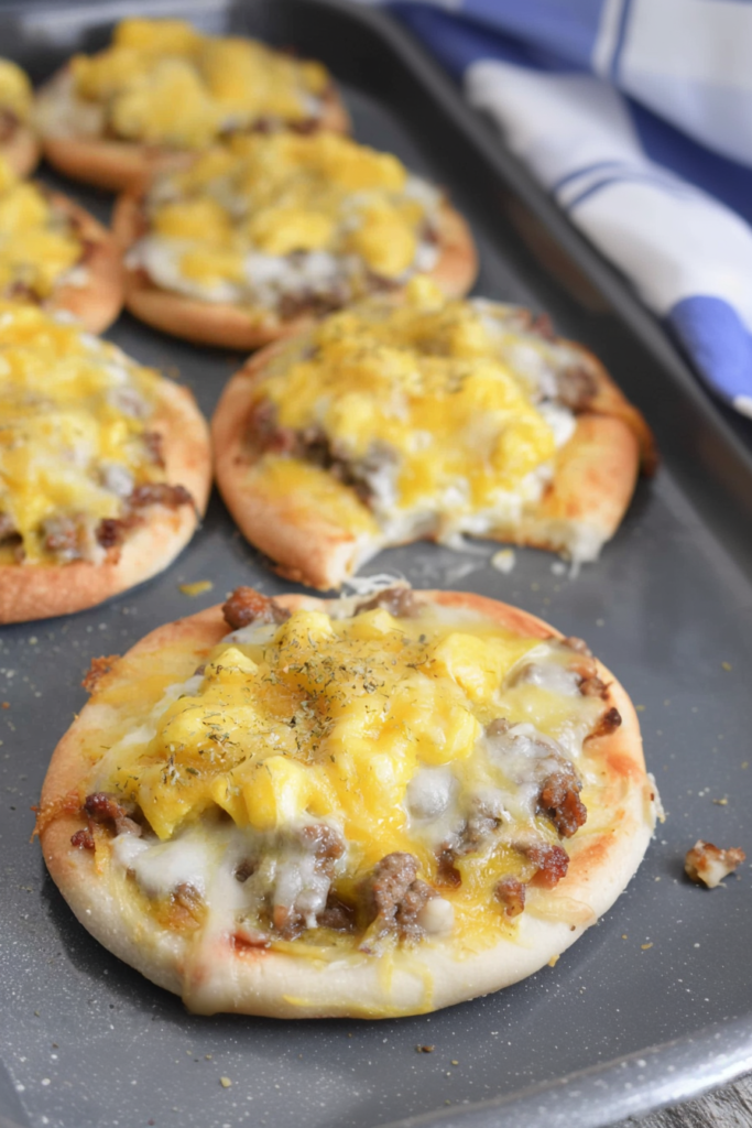 Homemade savory pizza topped with cheese and herbs, served warm from the oven.