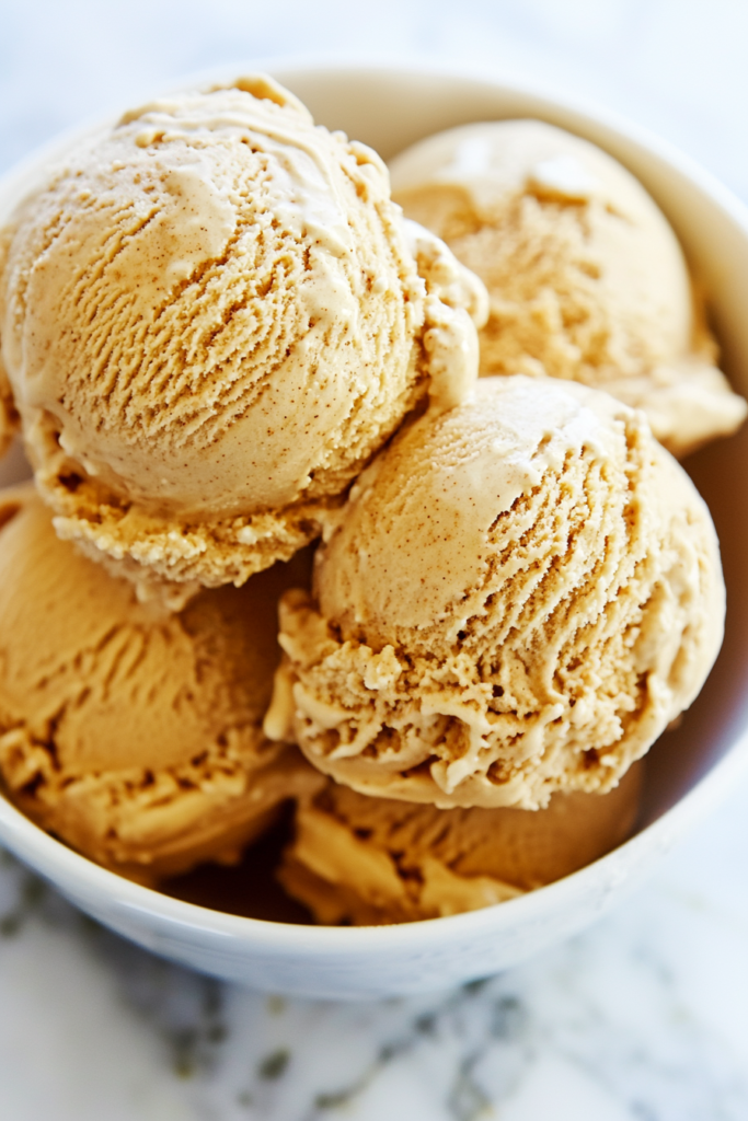 Close-up of spiced pumpkin dessert scoops with crunchy cookie swirls.