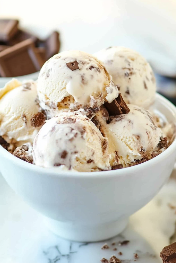Close-up of frozen dessert showing swirls of chocolate and bits of graham cracker throughout.