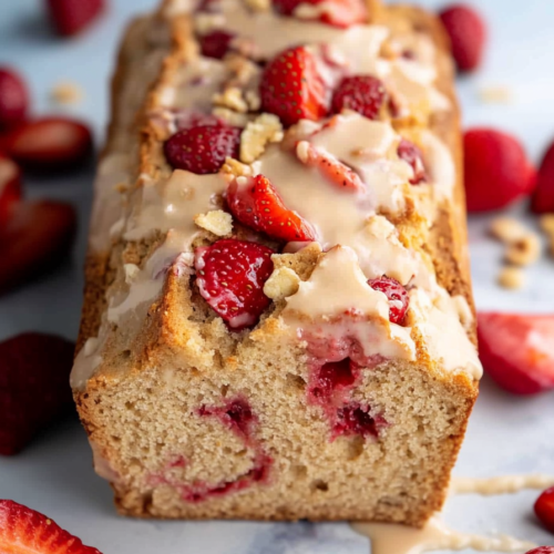 Fruit-filled bread served with fresh strawberries for garnish.