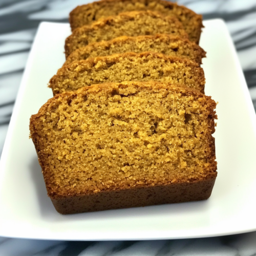 Thick slices of a warm baked loaf arranged neatly for serving