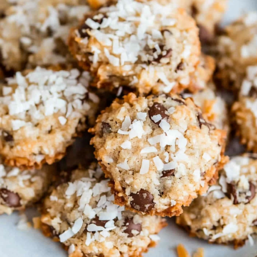 Freshly baked cookies showing a crumbly texture and nut topping.