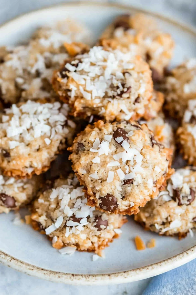 Freshly baked cookies showing a crumbly texture and nut topping.