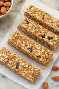 Healthy snack bars featuring oats, nuts, and dried fruit chunks.