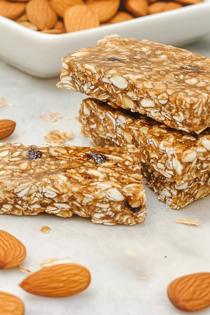 Almond-honey power bars arranged neatly with whole almonds for garnish.