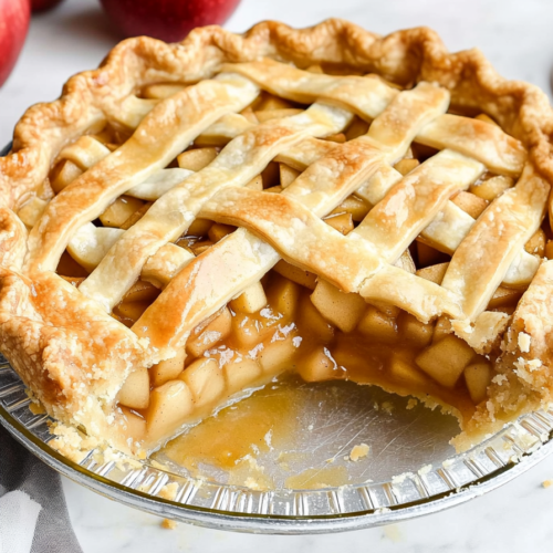 Freshly baked homemade pie with a flaky lattice crust and sweet apple filling.