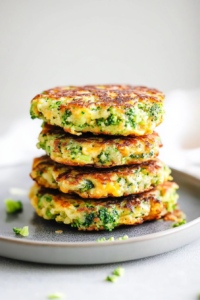 Close-up of crunchy fritters showing green and yellow vegetable filling."