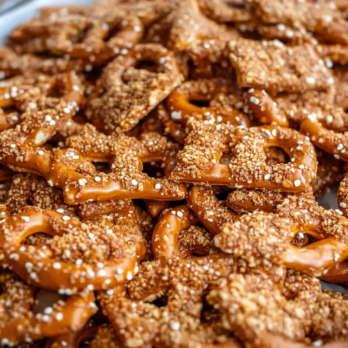 Close-up of crunchy pretzels coated in buttery toffee and sprinkled with sugar.