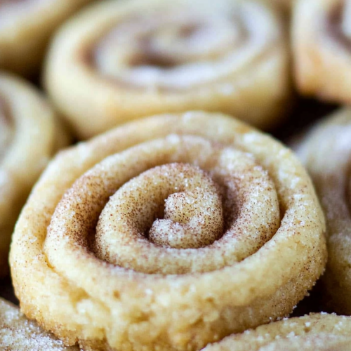 Close-up of crispy cinnamon sugar pie crust cookies baked until lightly golden.
