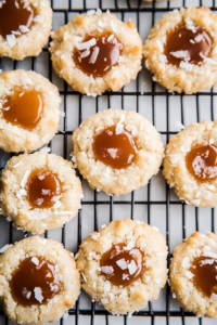 Homemade cookies featuring chewy coconut edges and salted caramel centers.
