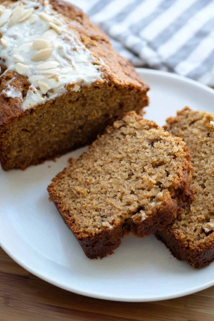 Golden-brown loaf packed with warm spices and topped with crunchy nuts.