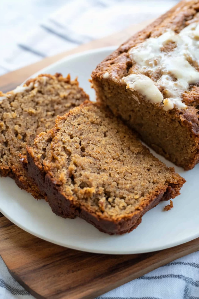 Thick slices of homemade spiced quick bread with a soft and slightly crumbly texture.