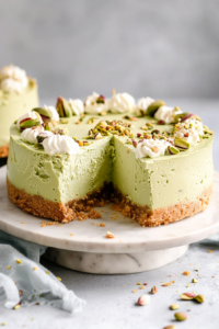 Slice-ready pistachio dessert with a thick nutty crust and light, airy filling.