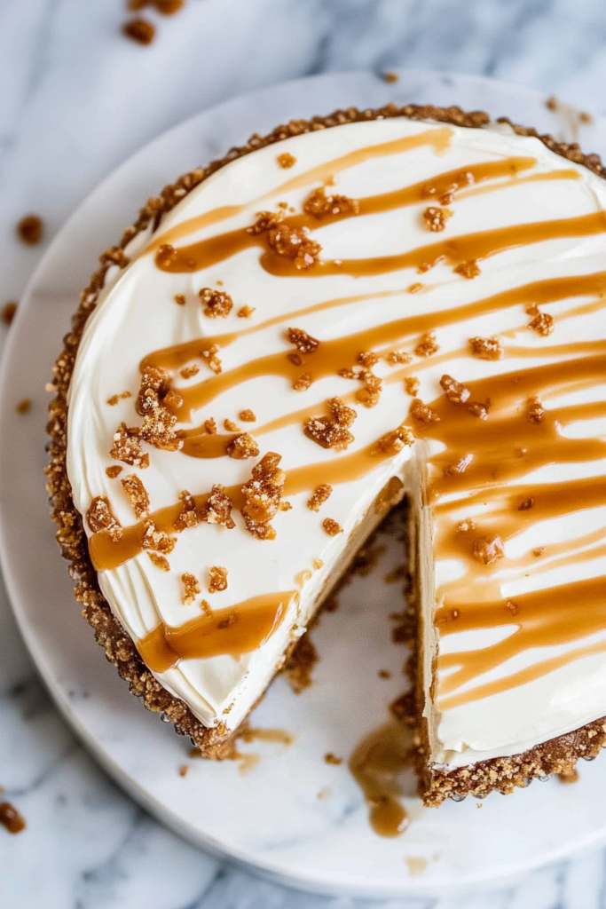 Golden crust and velvety cheesecake filling highlighted by a generous drizzle of salted caramel.