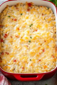 Close-up of hearty rice casserole, creamy texture highlighted against the pot.