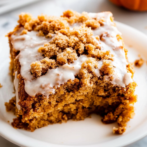 Final presentation of a spiced dessert highlighting its crumb layer and moist interior.