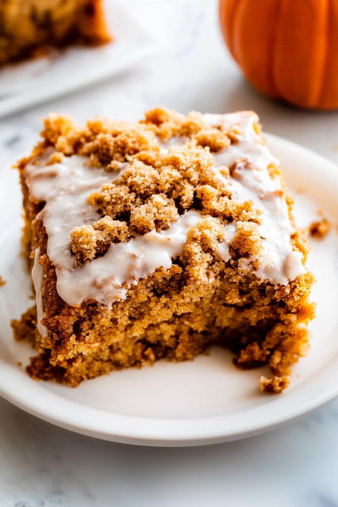 Final presentation of a spiced dessert highlighting its crumb layer and moist interior.