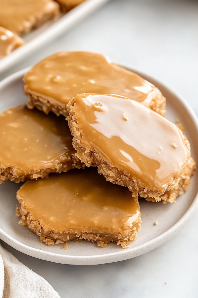 Sweet squares arranged neatly, shiny coating emphasizing their rich flavor.