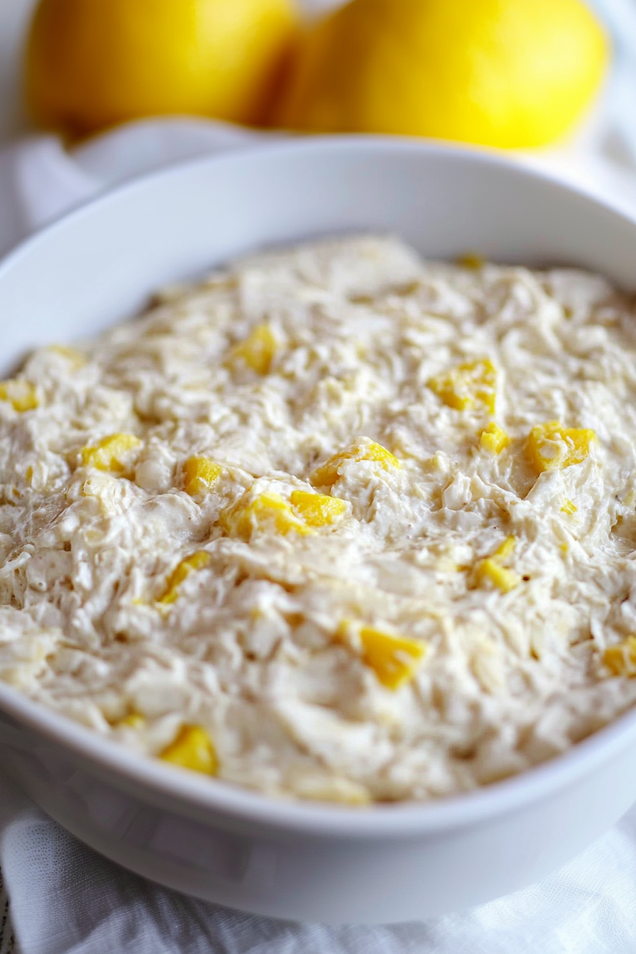 Close-up of tropical rice mixture highlighting fruit pieces and smooth texture