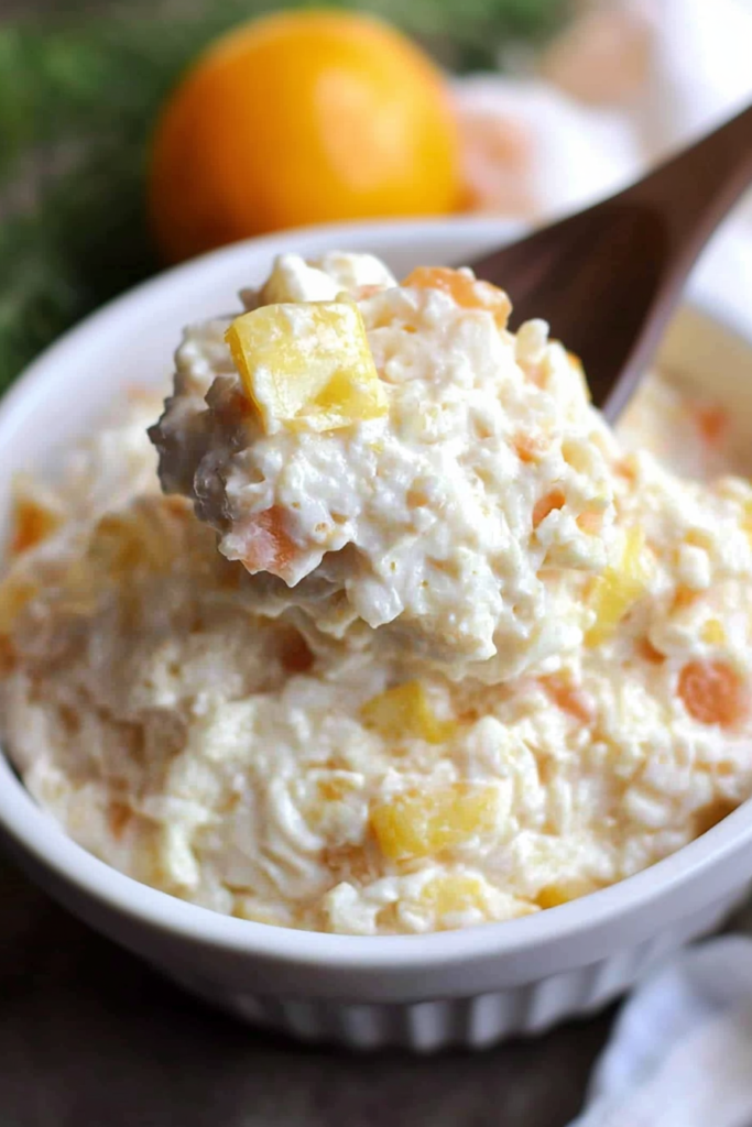 Creamy rice dish with chunks of pineapple served in a bowl