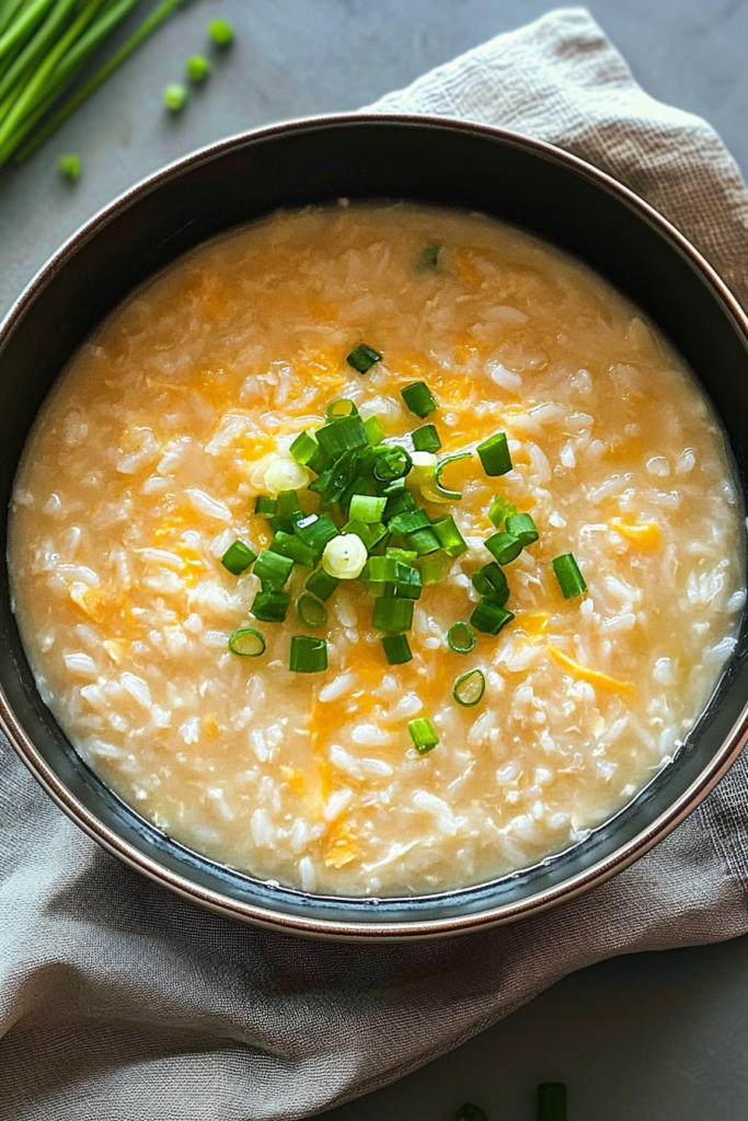 Cozy homemade comfort soup with tender rice and a light drizzle of broth, served in a ceramic bowl.