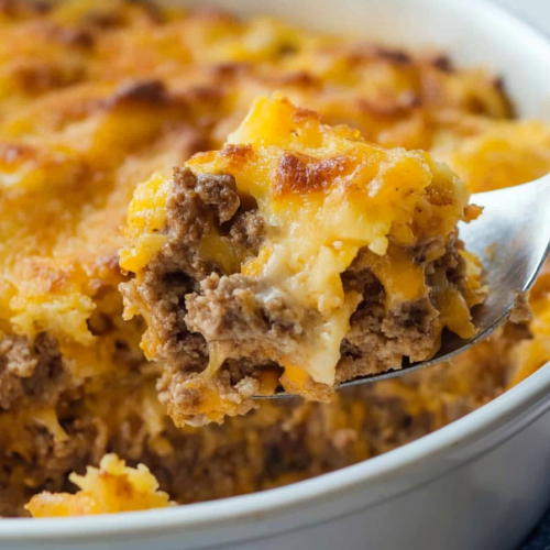 Freshly baked dish with crispy topping, highlighting the creamy layers of noodles and savory beef beneath.