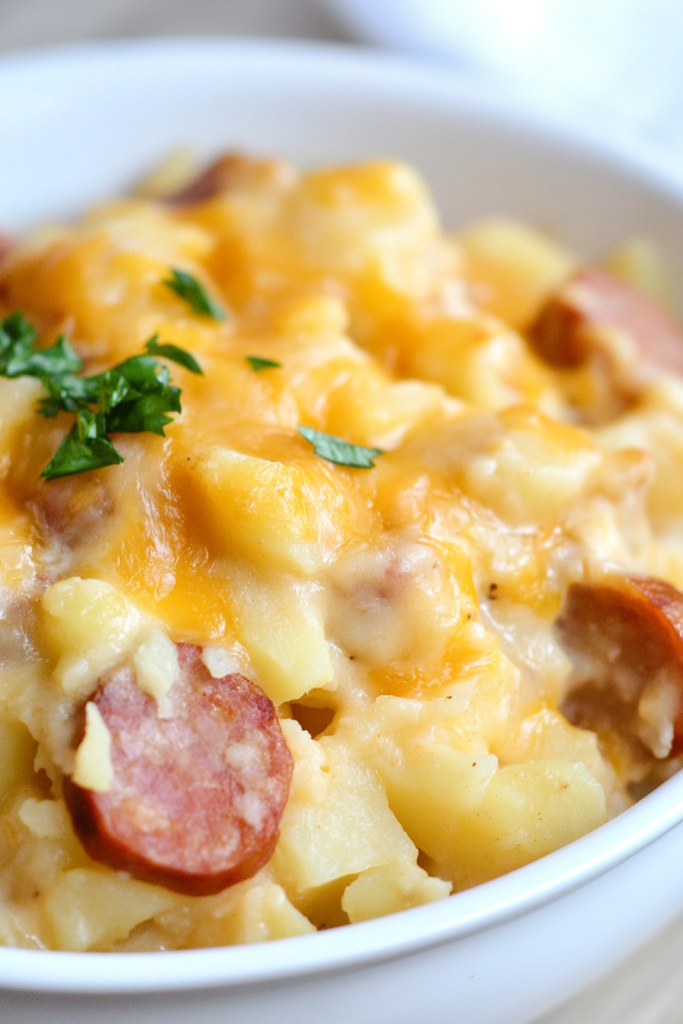 Warm, cheesy casserole presented on a wooden table with rustic accents.