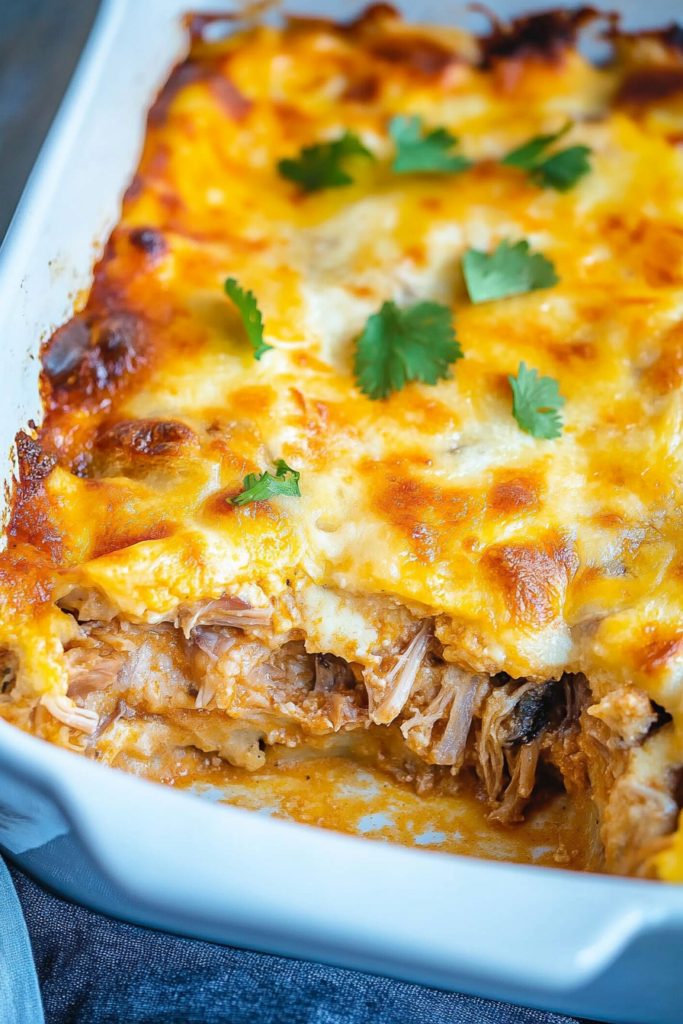 Hearty oven-baked dish with tender shredded filling and rich, cheesy top
