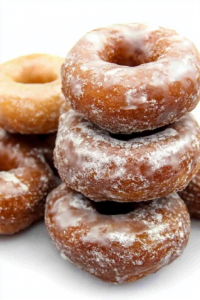 Golden brown homemade doughnuts with a crisp sugary coating