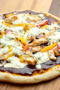 Freshly baked pizza with bubbling cheese and tangy sauce, cut into generous wedges.