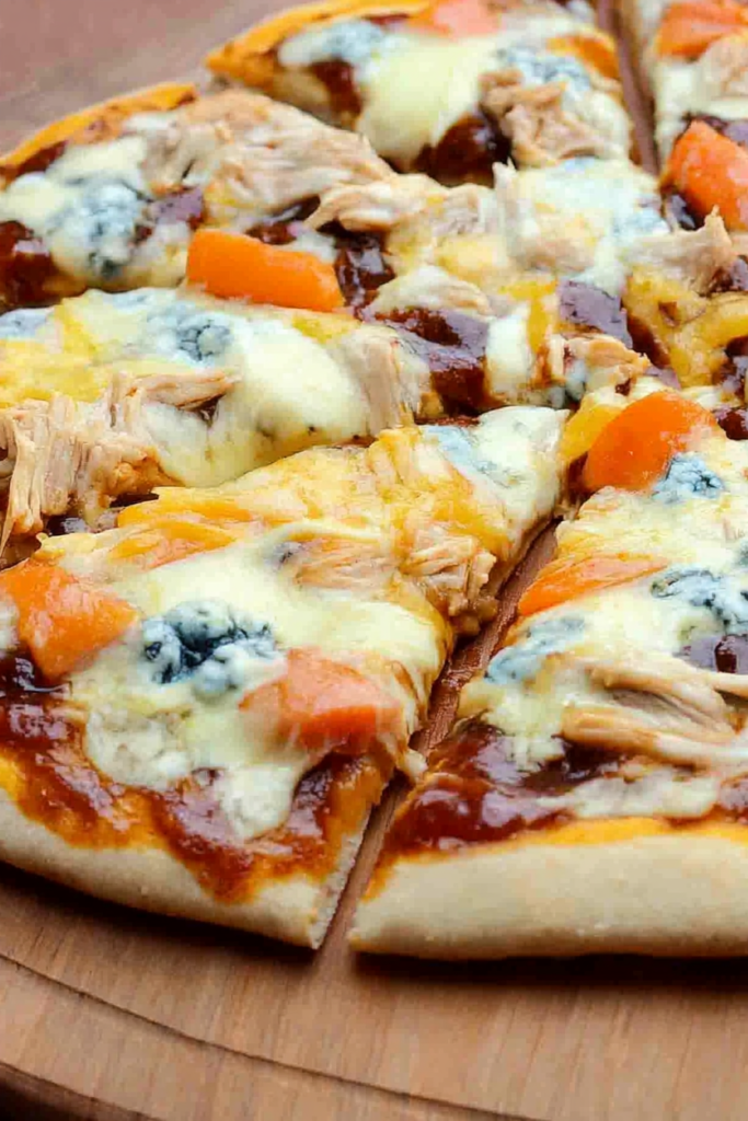 Close-up of sliced pizza highlighting gooey cheese, savory toppings, and crisp edges.