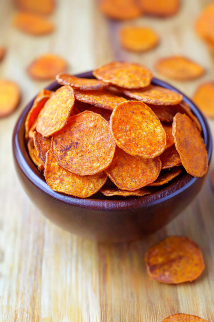 Bowl of homemade chips with a vibrant orange hue, inviting and snack-ready.