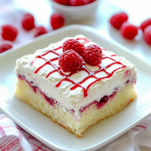 Elegant presentation of fruit-filled cake placed on a checkered cloth, highlighting texture and color contrast.