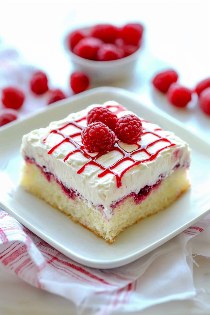 Elegant presentation of fruit-filled cake placed on a checkered cloth, highlighting texture and color contrast.