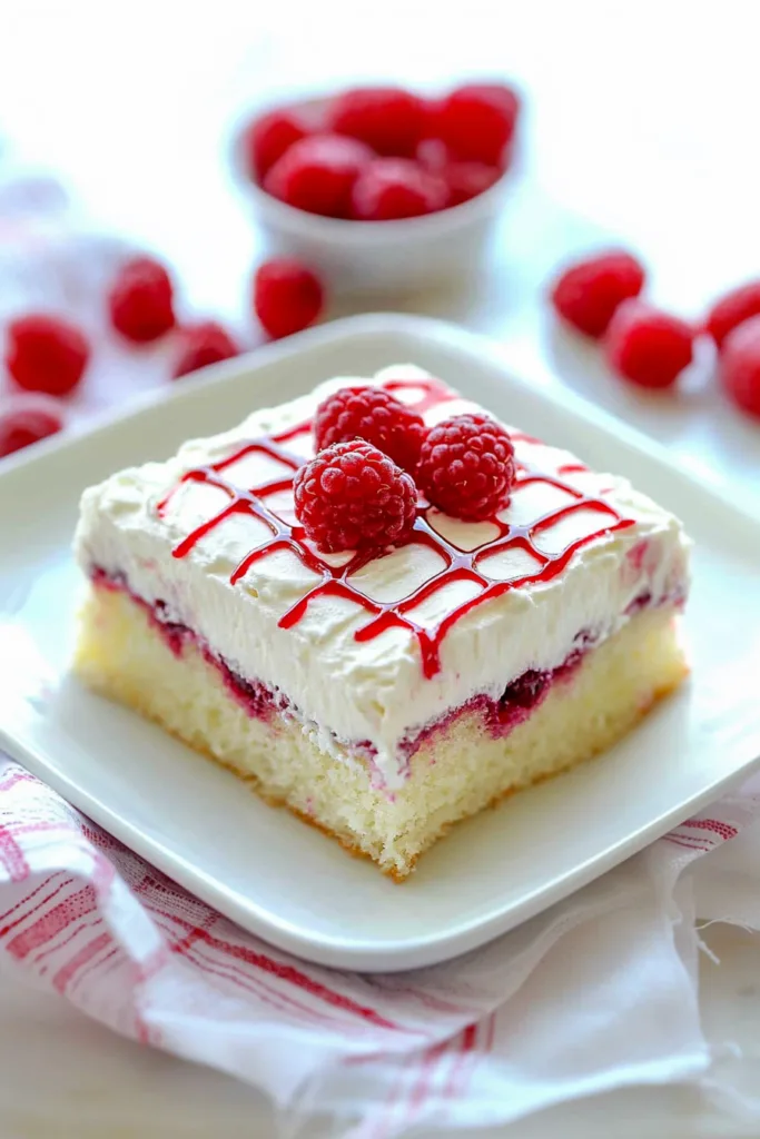 Elegant presentation of fruit-filled cake placed on a checkered cloth, highlighting texture and color contrast.