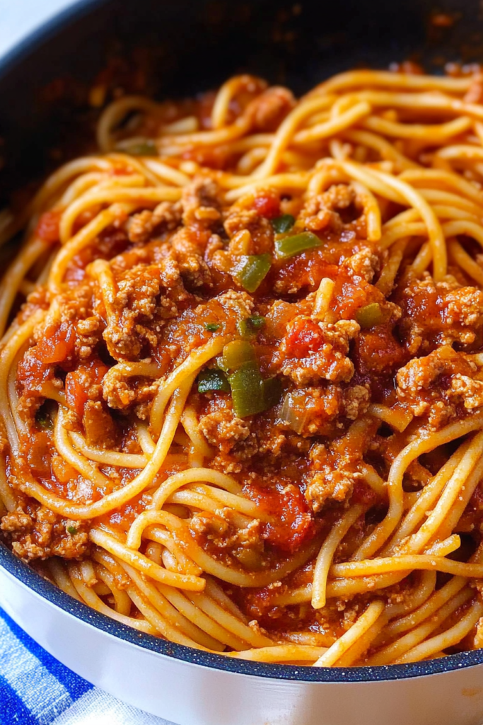 Hearty pasta bowl with rich sauce, fresh herbs, and vibrant presentation