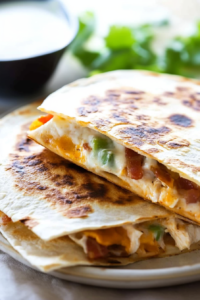 Warm toasted tortilla filled with savory chicken, cheese, and smoky bacon