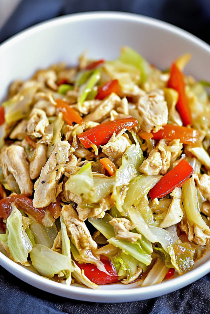 Juicy chicken strips tossed with soft cabbage and vibrant mixed vegetables