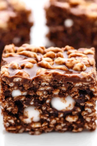 Fudgy chocolate squares topped with nuts and filled with chewy marshmallow bits.