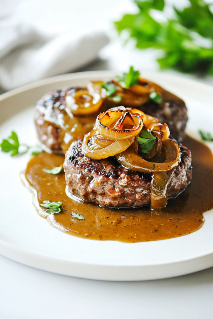 Juicy beef patties topped with caramelized onions and rich brown gravy