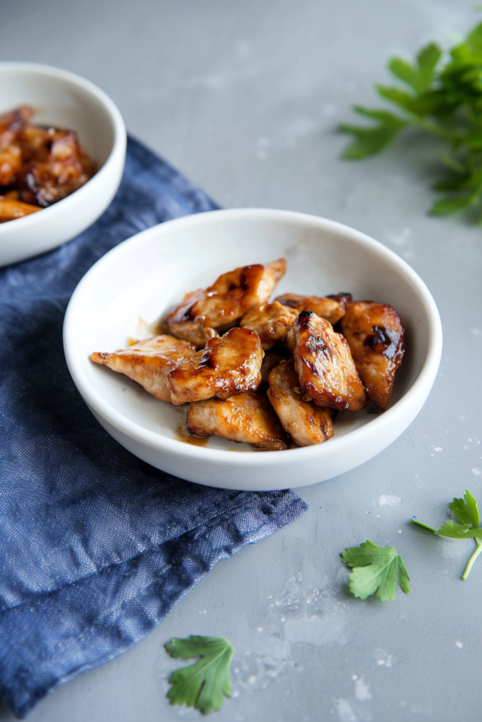 Caramelized chicken chunks with glossy sauce served as a finished dish