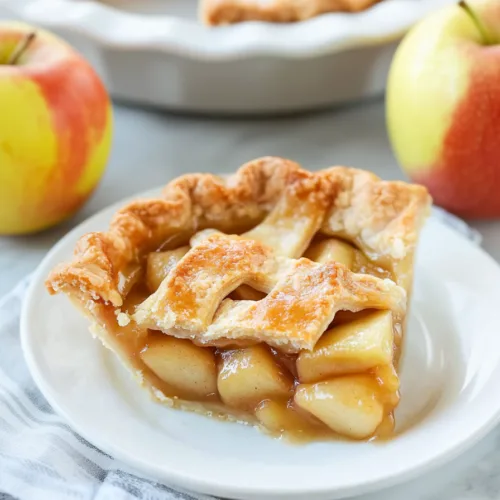 Homemade apple dessert with glossy filling and crisp crust, ready to serve