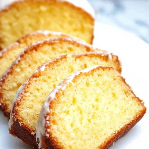 Freshly baked loaf with a light orange glaze and tender golden interior