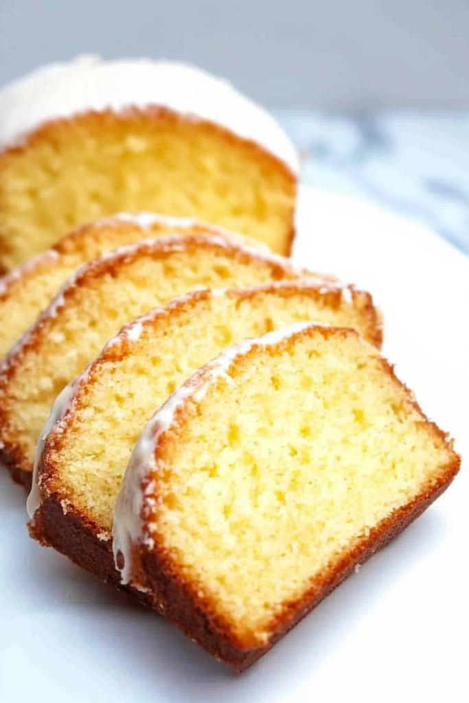 Freshly baked loaf with a light orange glaze and tender golden interior