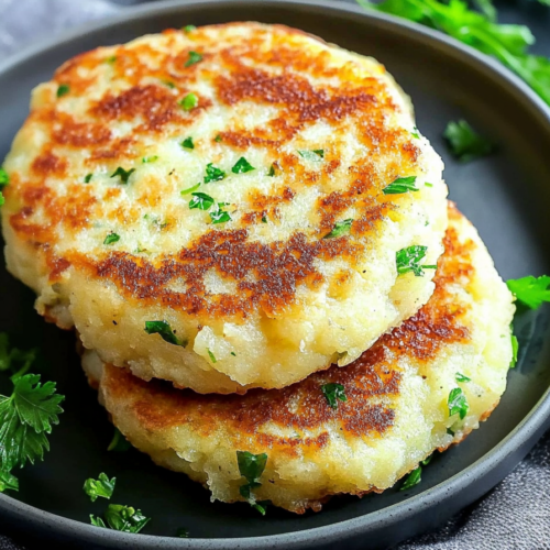 Final plated shot of Potato Parsley Cakes, highlighting golden crust and green herb garnish