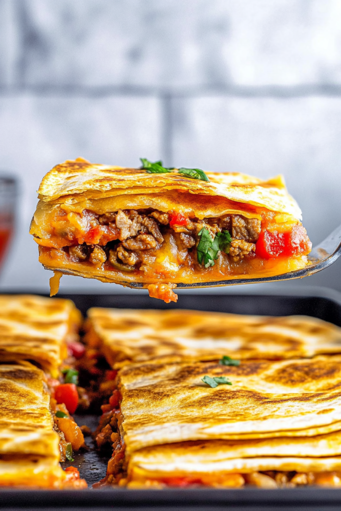 Close-up of cheesy quesadilla slices with browned edges and fresh cilantro garnish.